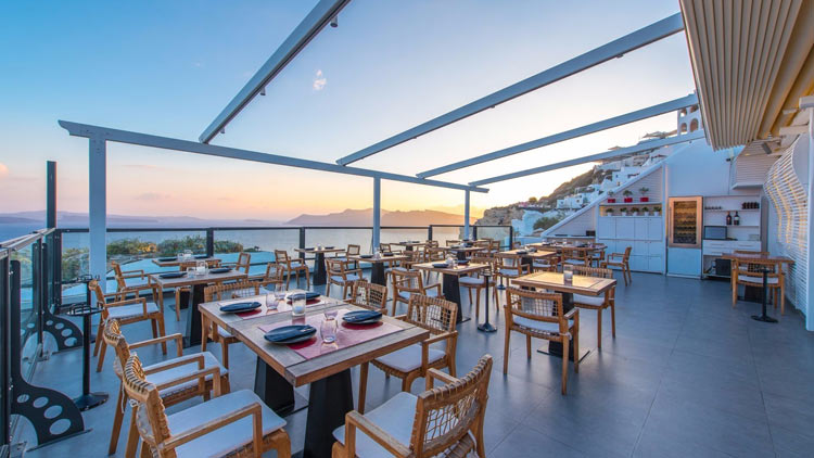 Sunset Over Black Rock Restaurant, Santorini Secret Suites & Spa