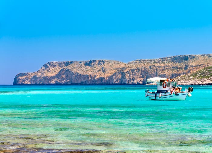 Fishing boat – Balos Beach, Crete honeymoon exploration with Travelive, luxury travel agency